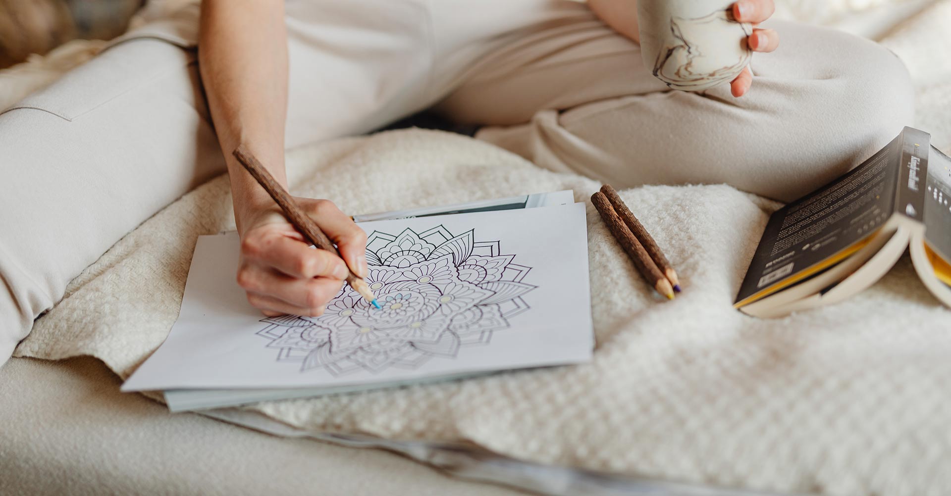 Person completing a mindful colouring exercise